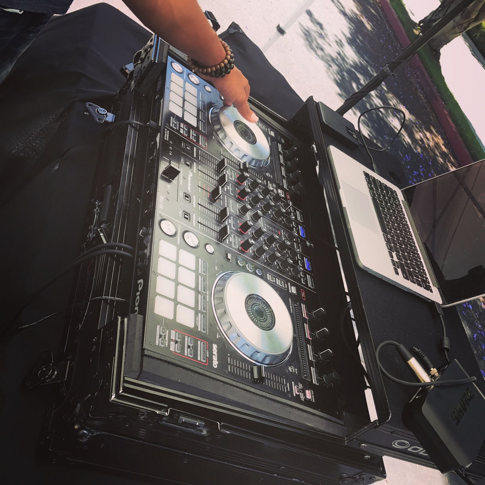 DJ controller set up at an outdoor health fair