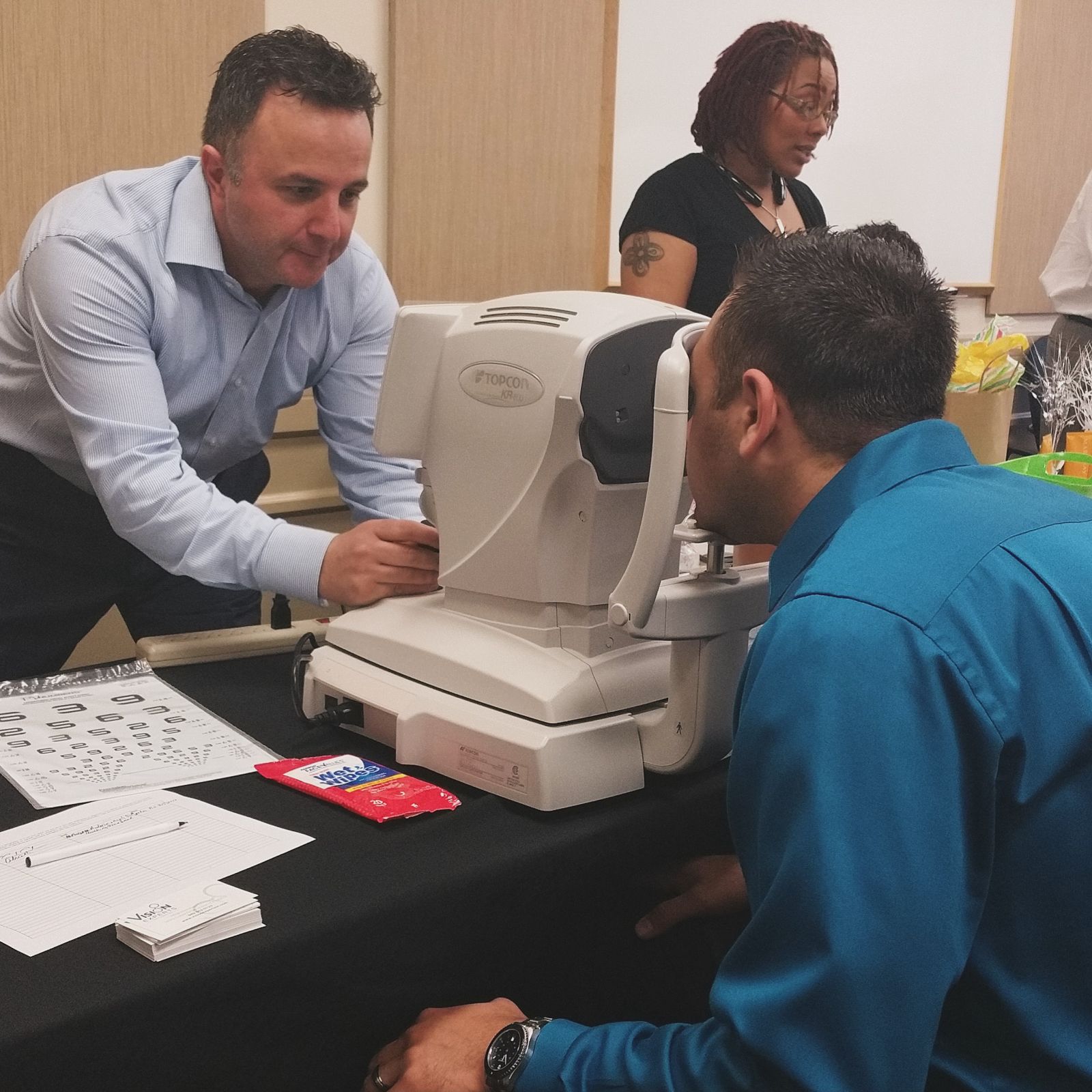 Employee getting a vision screening at a health fair