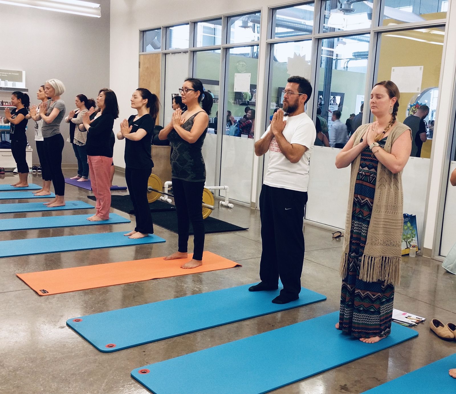 Employees in an onsite yoga class